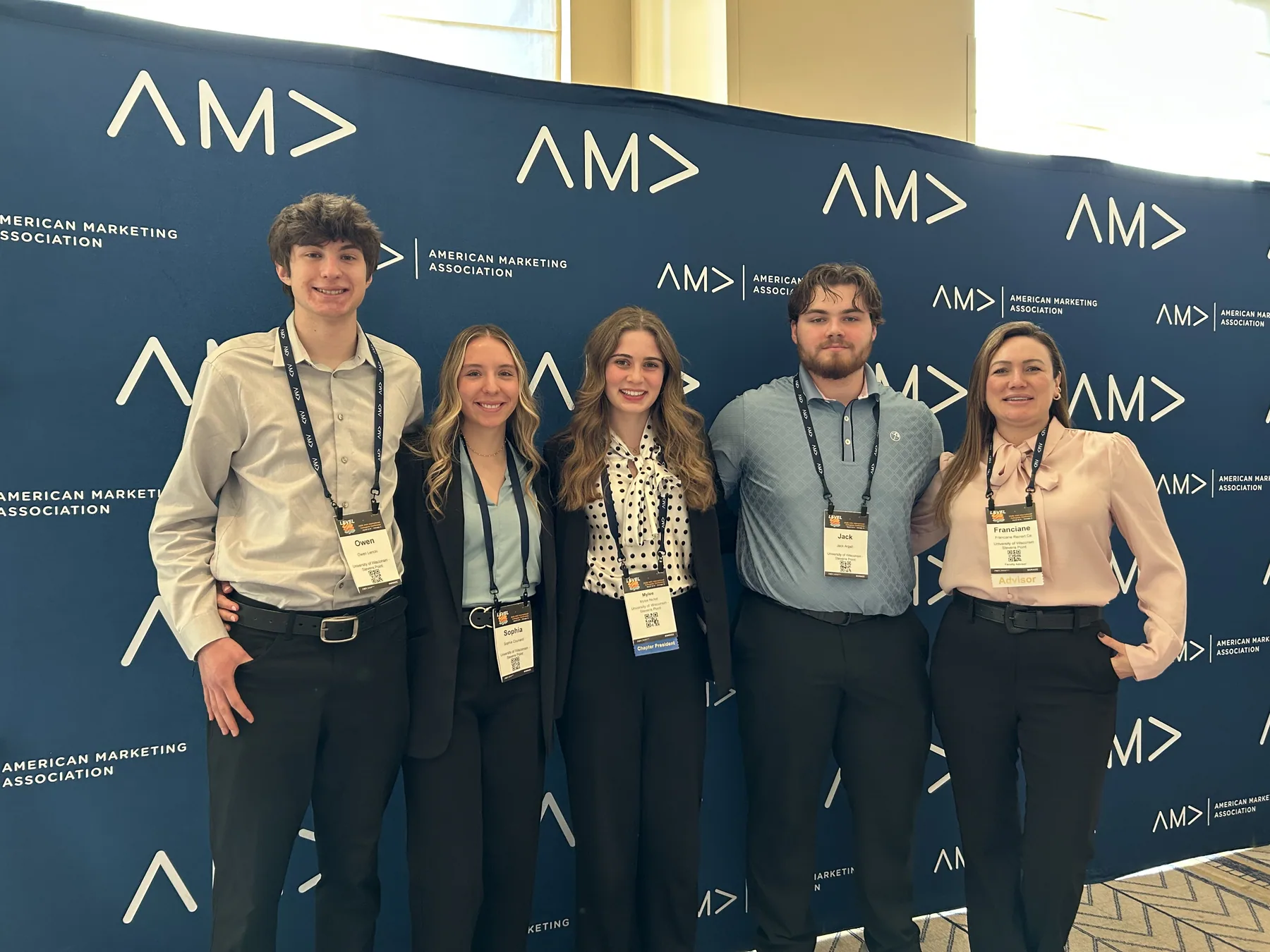 The UWSP AMA group in front of the American Marketing Association backdrop at the 2026 International Collegiate Conference in Chicago.